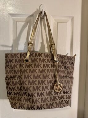 A Michael Kors Brown MK Logo Tote with Gold Hardware